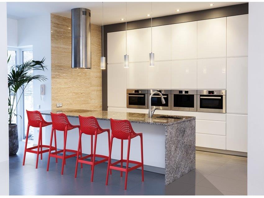 Art 65 centimetre resin stools in red shown at kitchen  bench