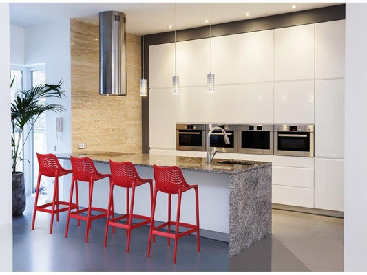 Art 65 centimetre resin stools in red shown at kitchen  bench